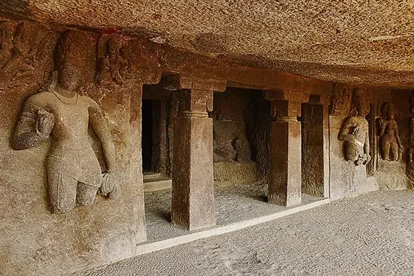 Rock-cut cliff architecture representing the Ajanta Caves UNESCO World Heritage Site, visited on the KP Travels Aurangabad tour from Pune